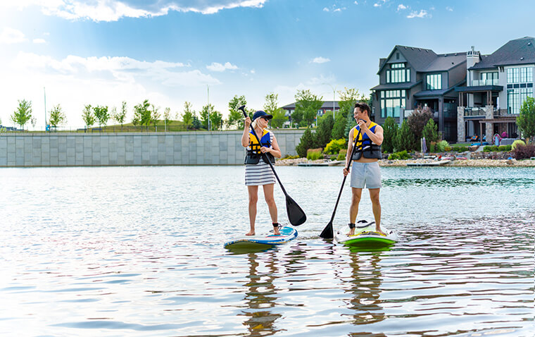 Two people paddleboarding on the lake