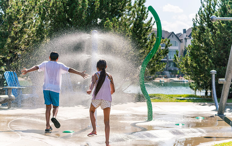 Kids playing at the local spray park