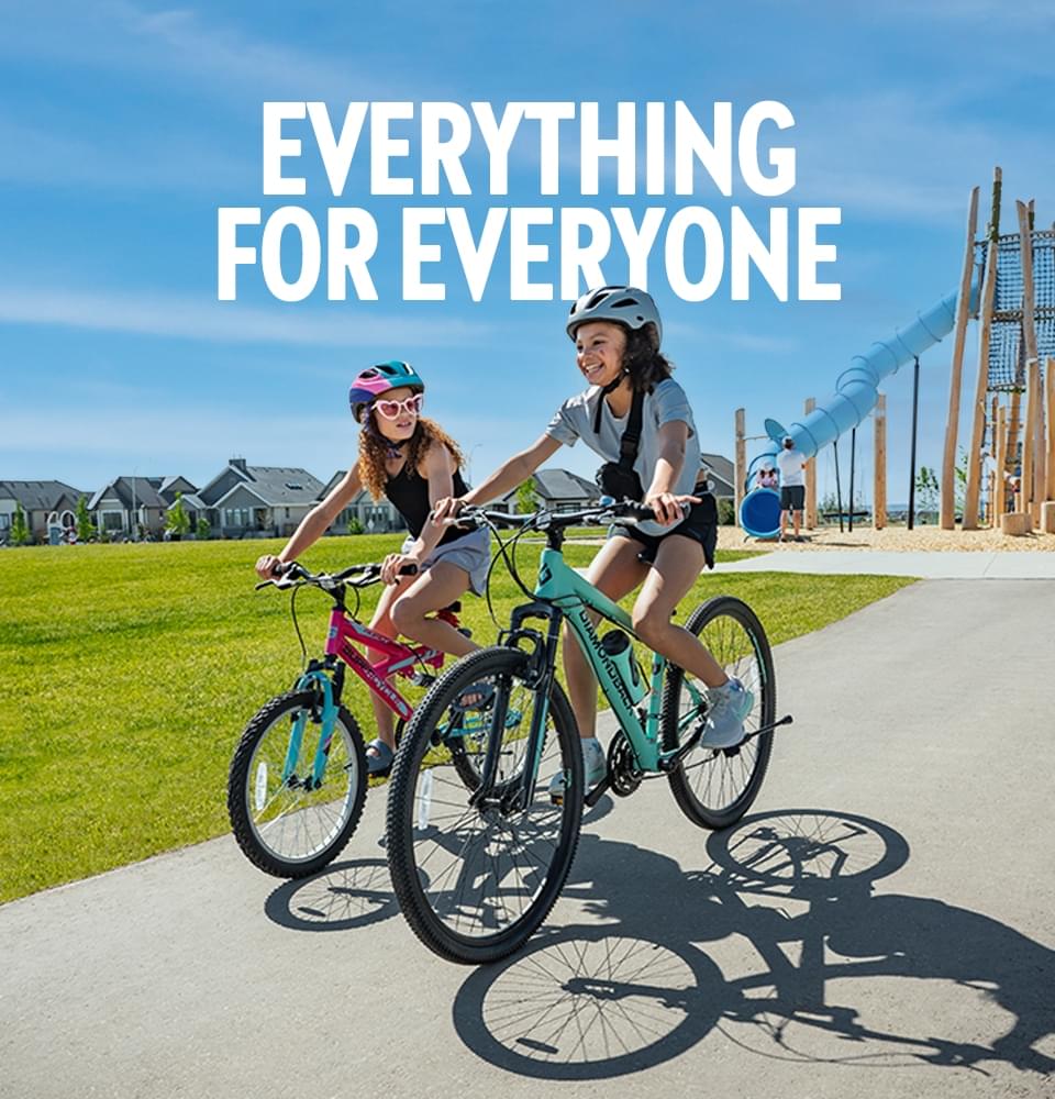 Girls riding bicycle on pathway